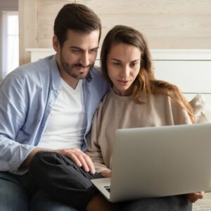 img of a couple looking at a computer